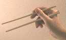 Image animée d'une main manipulant une baguette